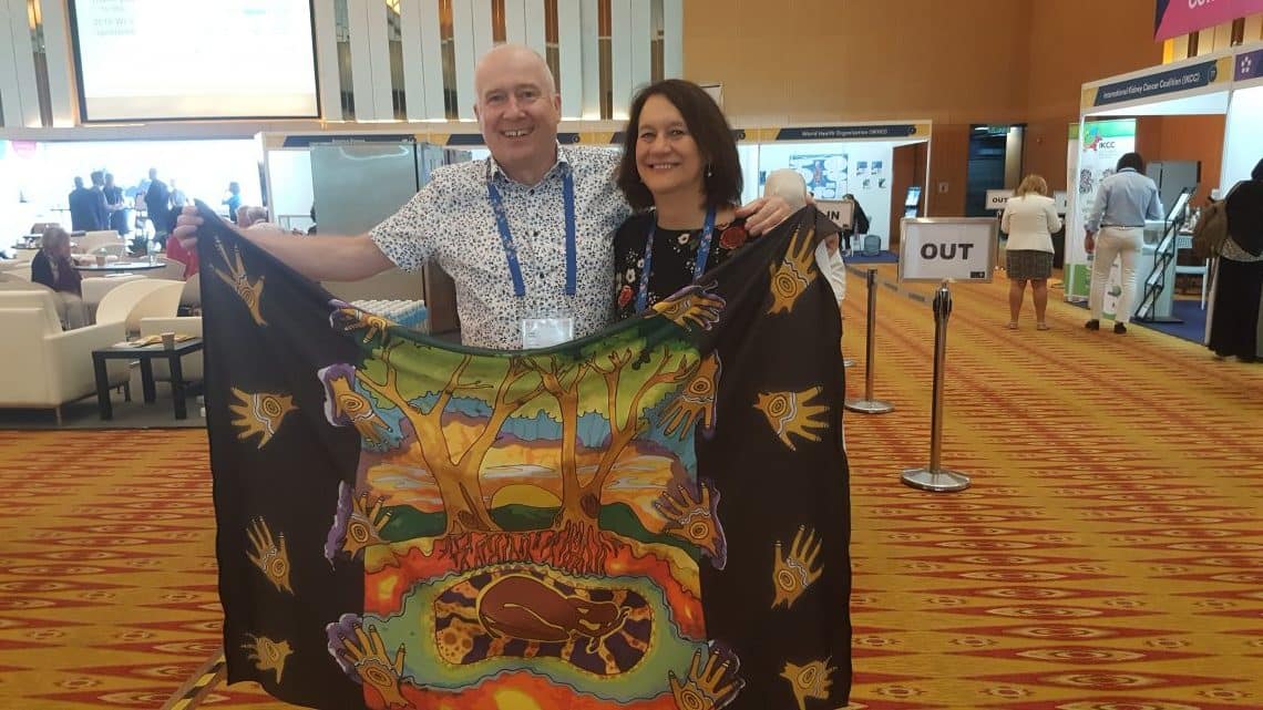 With Leonie Young, my great friend from Australia! We are holding an Aborigine 'modesty shawl' for ladies having breast examinations.