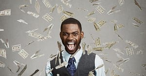 Man being showered in cash