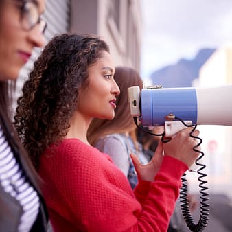 Lady with a megaphone, speaking out.