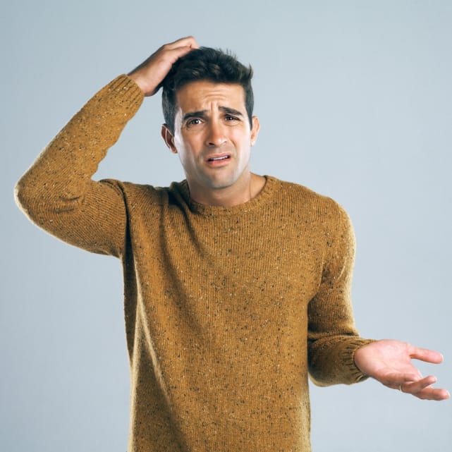 Man scratching his head